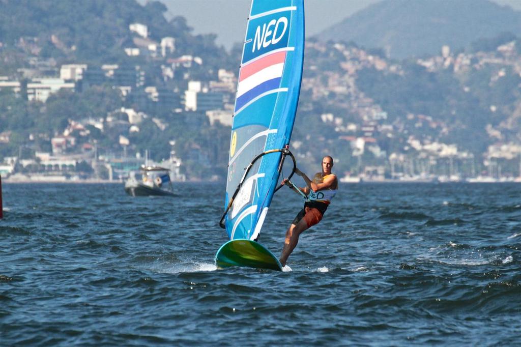 Day 7 - RS:X Mens August 14, 2016. Medal race. Dorian van Rijsselberghe (NED) approaching the finish line and a Gold Medal © Richard Gladwell www.photosport.co.nz